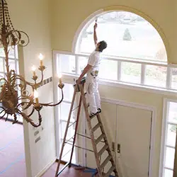 man painting ceiling