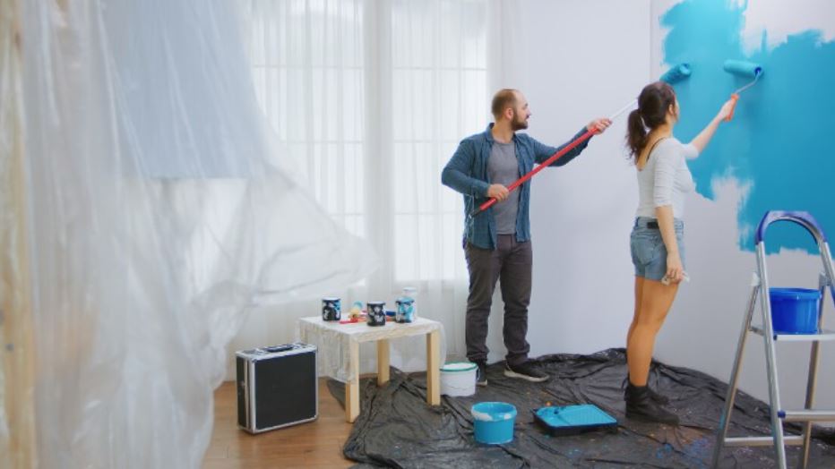 couple painting a room together