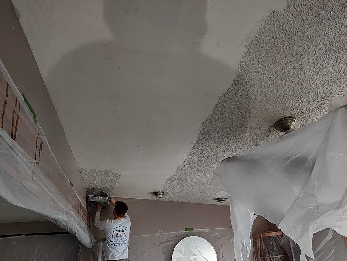 Skimming over a painted popcorn ceiling